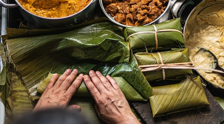 Person preparing tamal